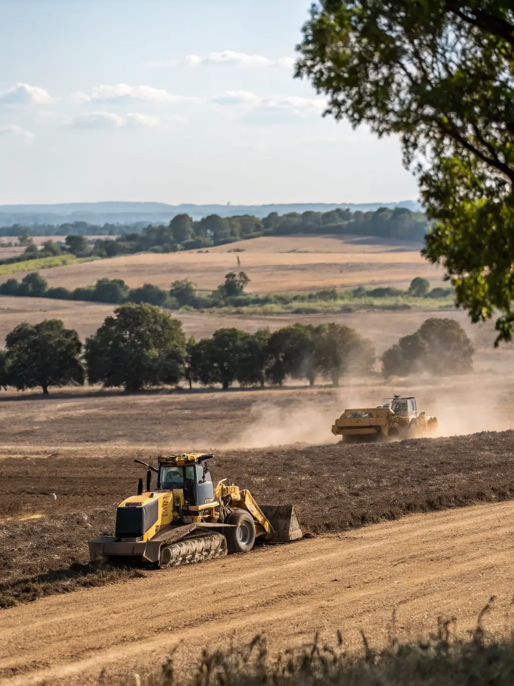 Heavy machinery leveling a plot of land, preparing it for construction, highlighting Hendersons Construction LLC's lot clearing and excavation expertise.